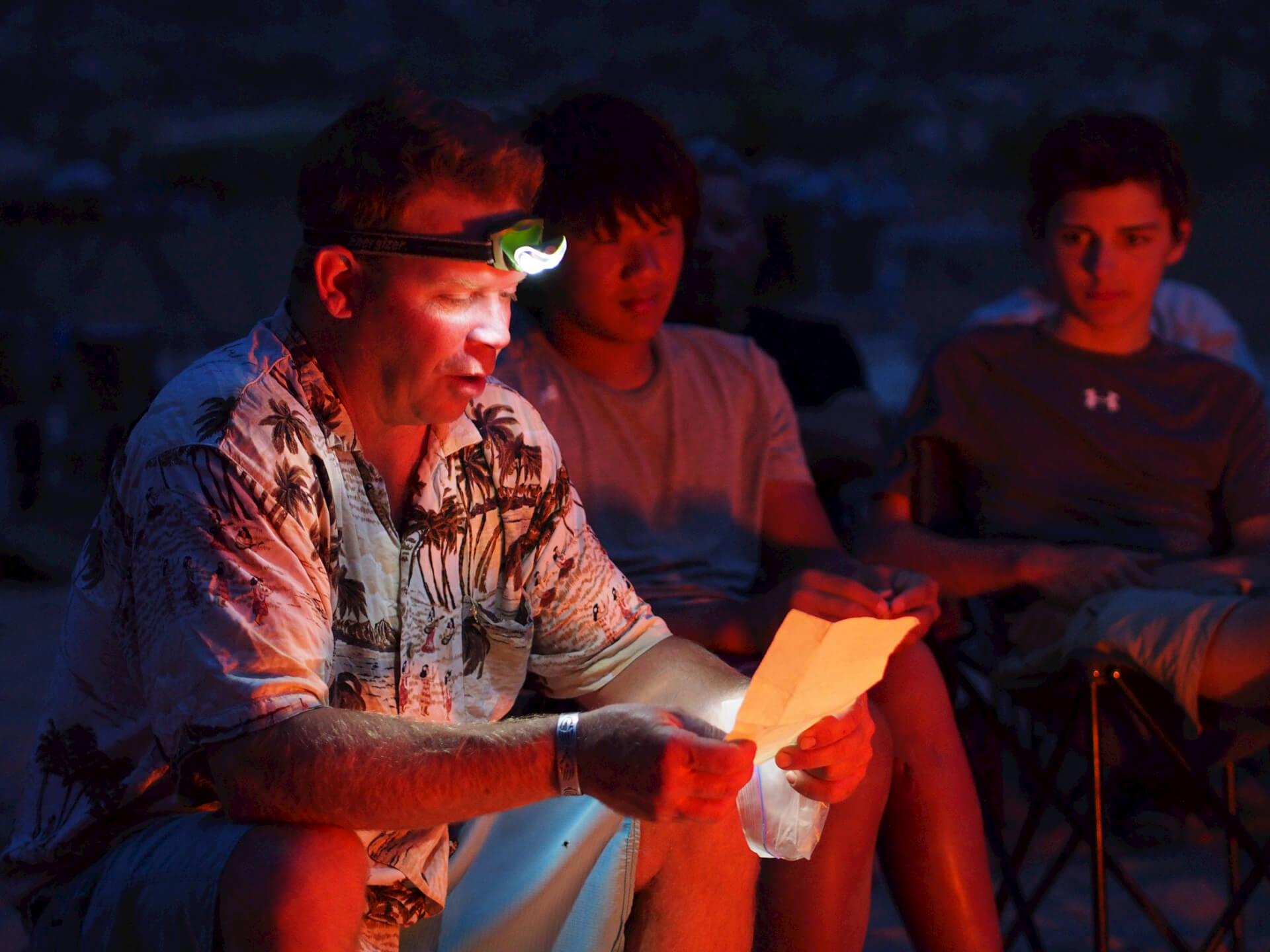 Brock reads river stories to Grand Canyon Whitewater rafters. 