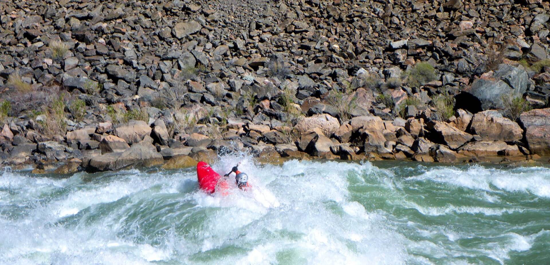 Grand Canyon guide, Tyler, kayaking Hermit Rapid.