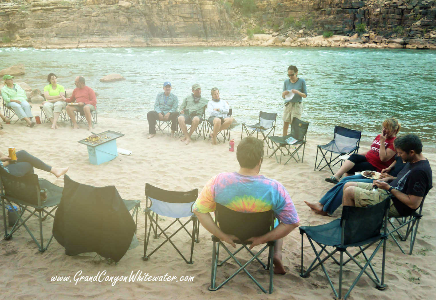 Grand Canyon Whitewater passengers relax  along the Colorado River.