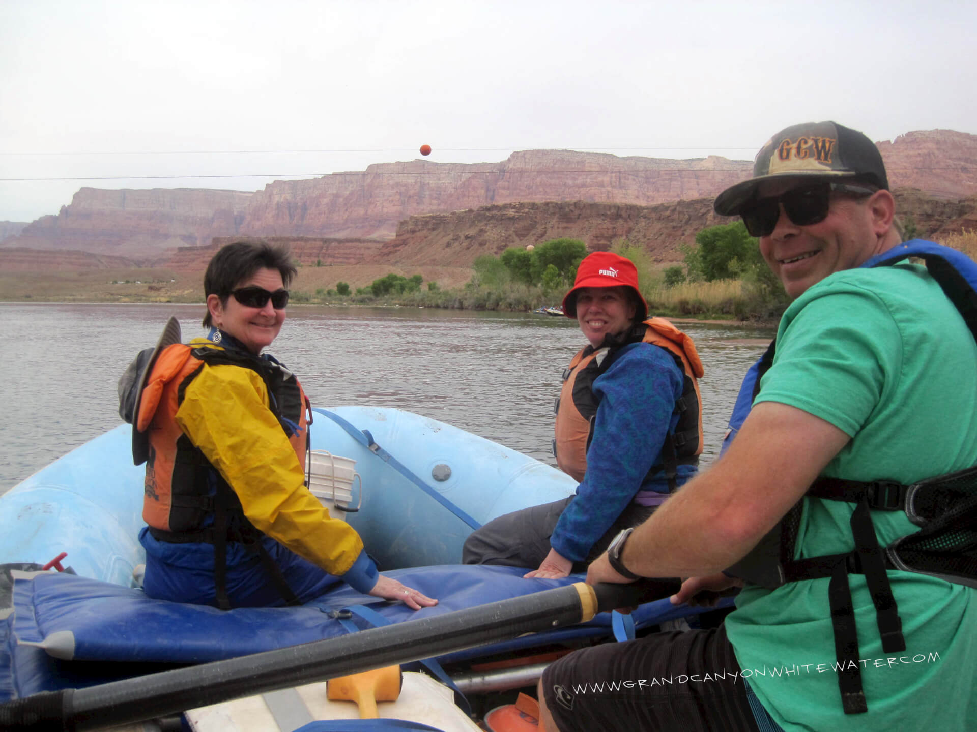 Grand Canyon Whitewater boatman, Brock, launches with full raft from Lees Ferry. 