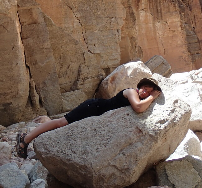 Rafter sleeping on a rock