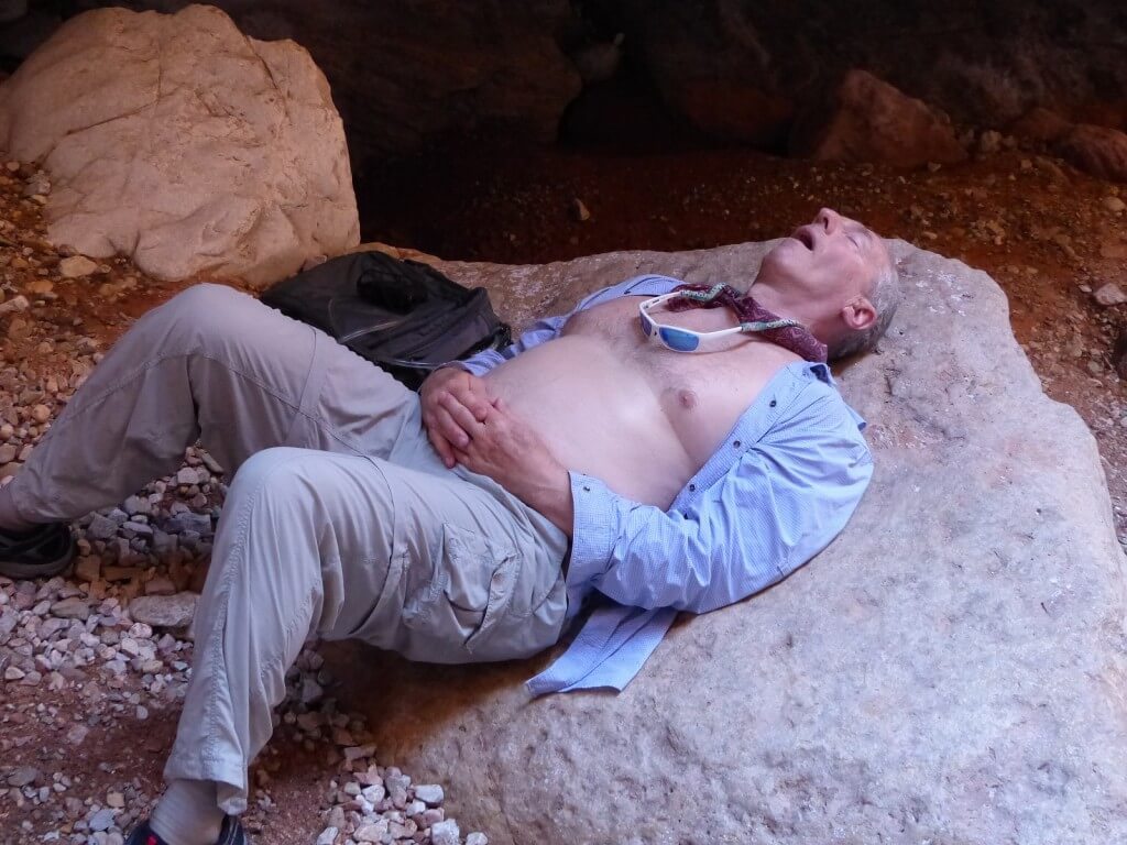 Rafter sleeping on a rock in Grand Canyon