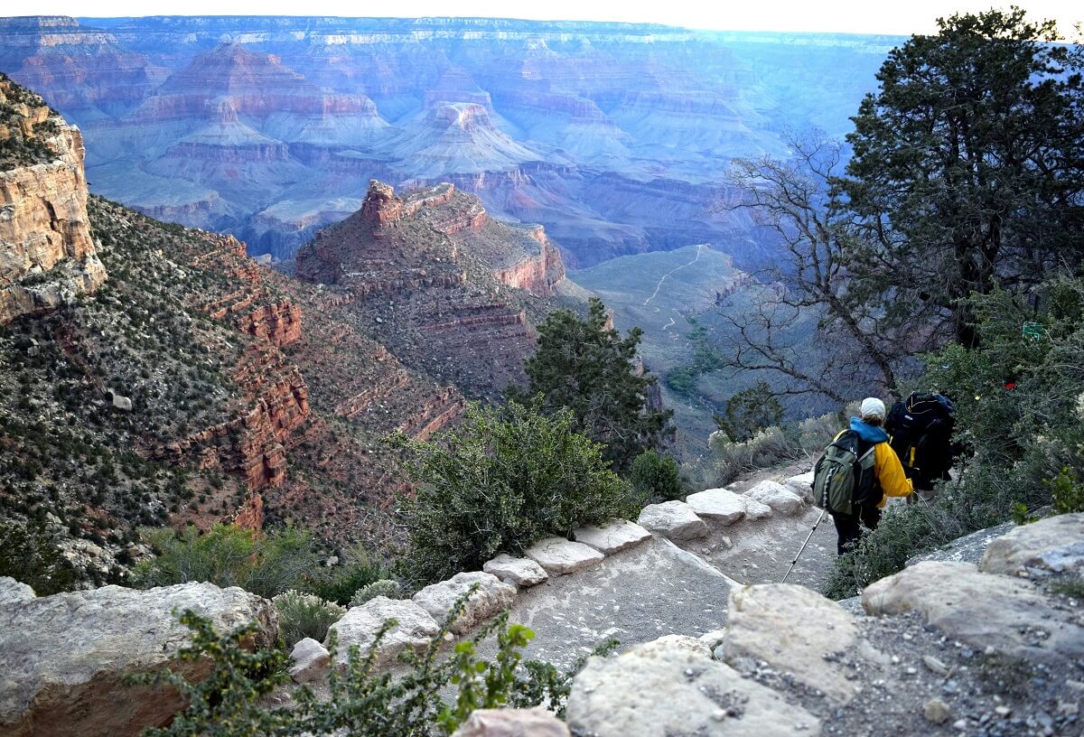 Backpackers on an early-morning hike have Bright Angel Trail to themselves. 