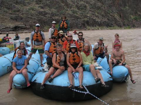 a family enjoying their Grand Canyon river rafting trip
