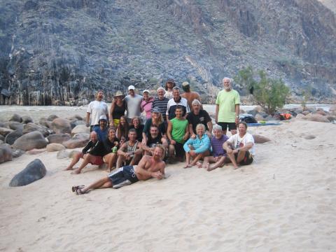 group on the beach enjoying their Grand Canyon river rafting trip