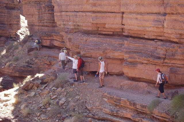 Grand Canyon Whitewater guests and guides hiking Deer Creek Narrows.