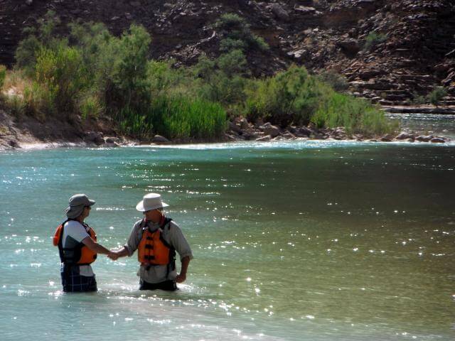 Grand Canyon Whitewater rafters "meet at the Confluence" of the LC and the Colorado Rivers.