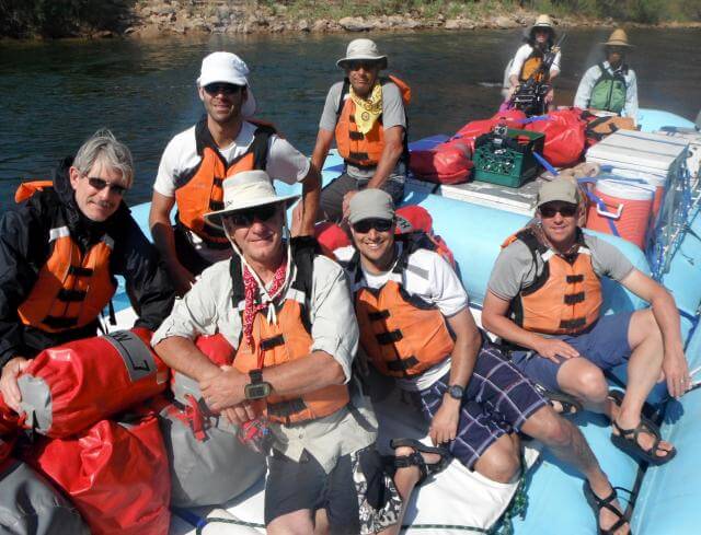 A group of Grand Canyon Whitewater passengers enjoy the raft. 