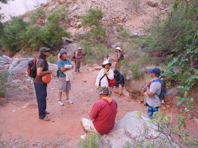 Grand Canyon Whitewater Guides and Guests Relax on a Hike.