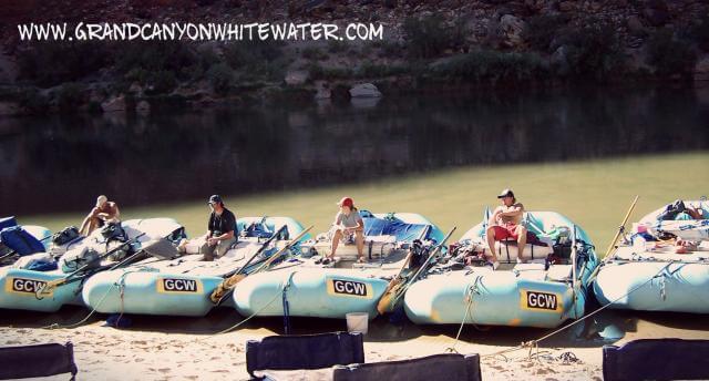 Grand Canyon Whitewater guides relax after a long day of rowing boats.