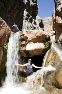 woman enjoying a waterfall
