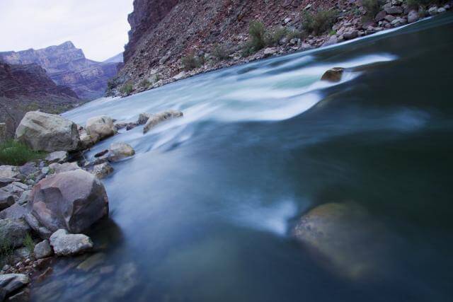 Sleep under the stars as the sounds of the river rush by on a Grand Canyon raft trip.