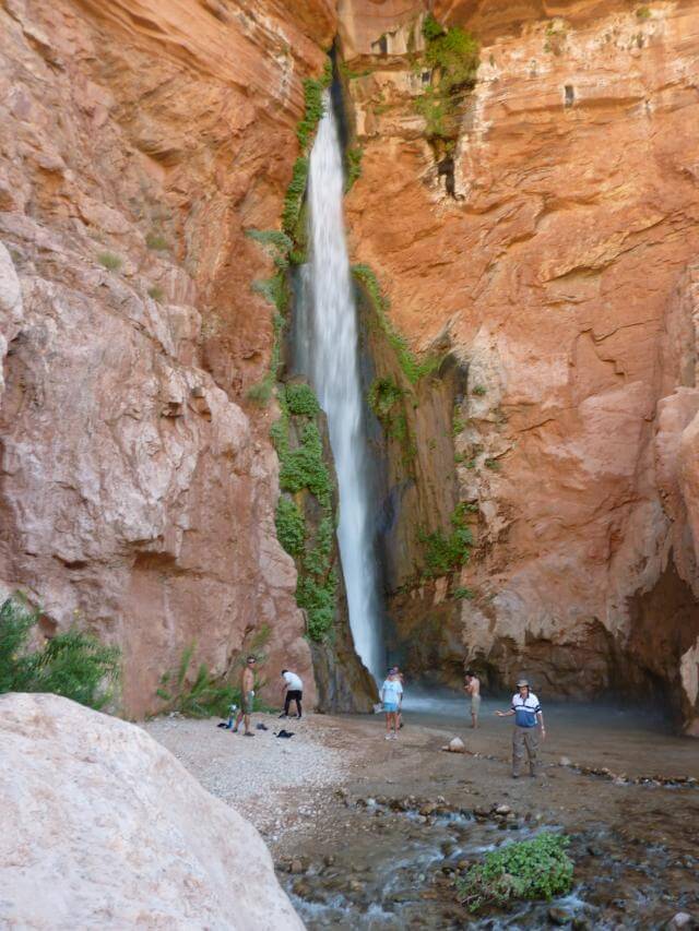 Grand Canyon Whitewater raft trip stops to check out Deer Creek Falls.