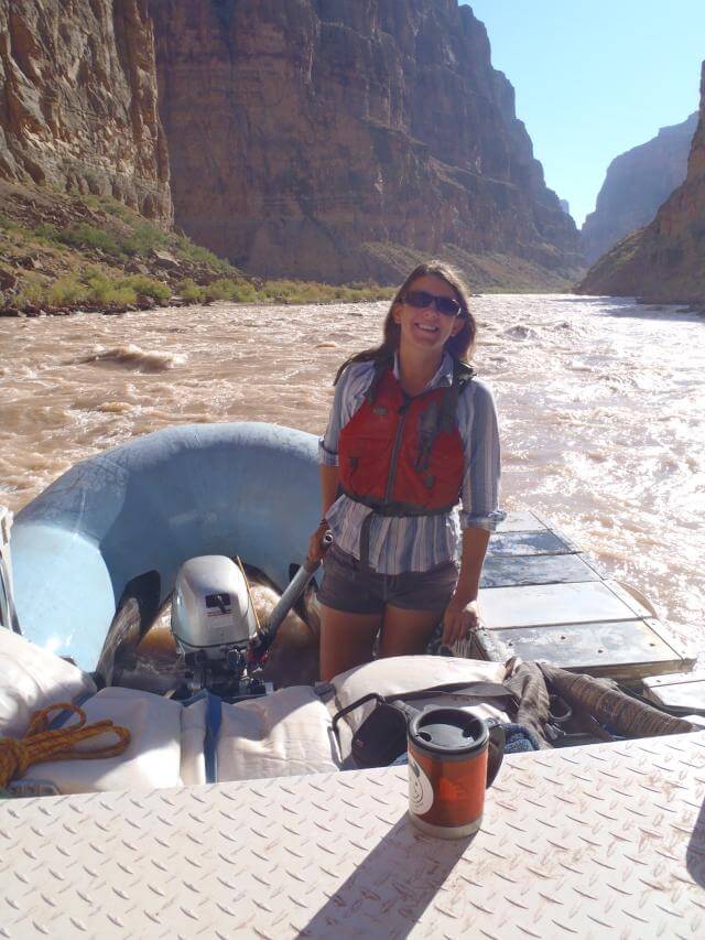 Grand Canyon Whitewater guide Thea Leander drives one of our custom-built motor boats along the Colorado River.