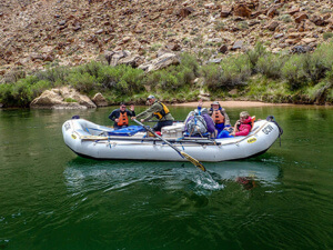 GCW guide Doug L rows a boat in the Canyon