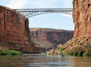 GCW oar boats travel under the Navajo Bridge. 