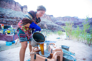 River guide making coffee in Grand Canyon.