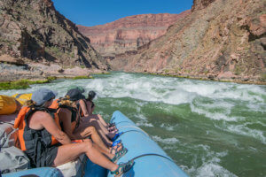 Motor boat going through a Grand Canyon rapid