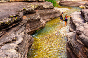 People walking in a creek in Grand Canyon.