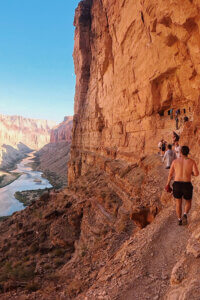 People hiking at Nankoweap Granaries.