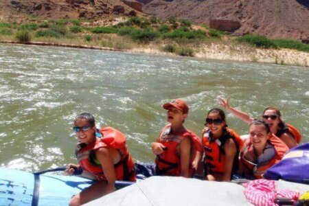 Kids enjoy a white water raft trip in Grand Canyon.