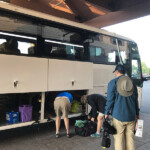 Loading your duffles on the bus.