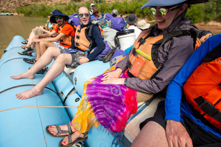 Sarong draped over legs on a motor boat.