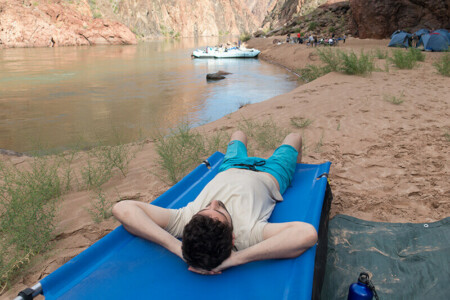 Relaxing on a river trip cot