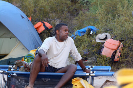 Sitting on a river trip cot