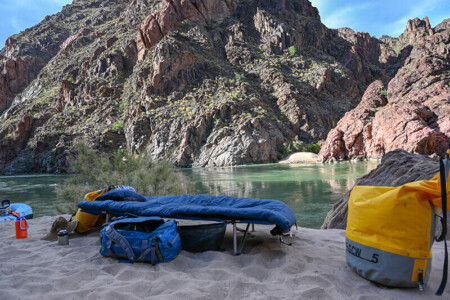 River trip cot and dry bags