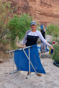 Setting up a river trip cot
